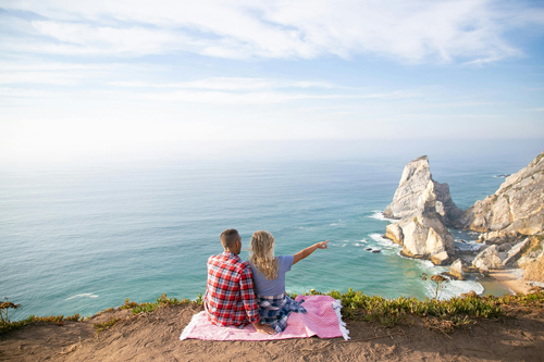 A happy couple enjoying their successfully planned honeymoon.